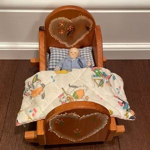 Vintage porcelain doll and bed